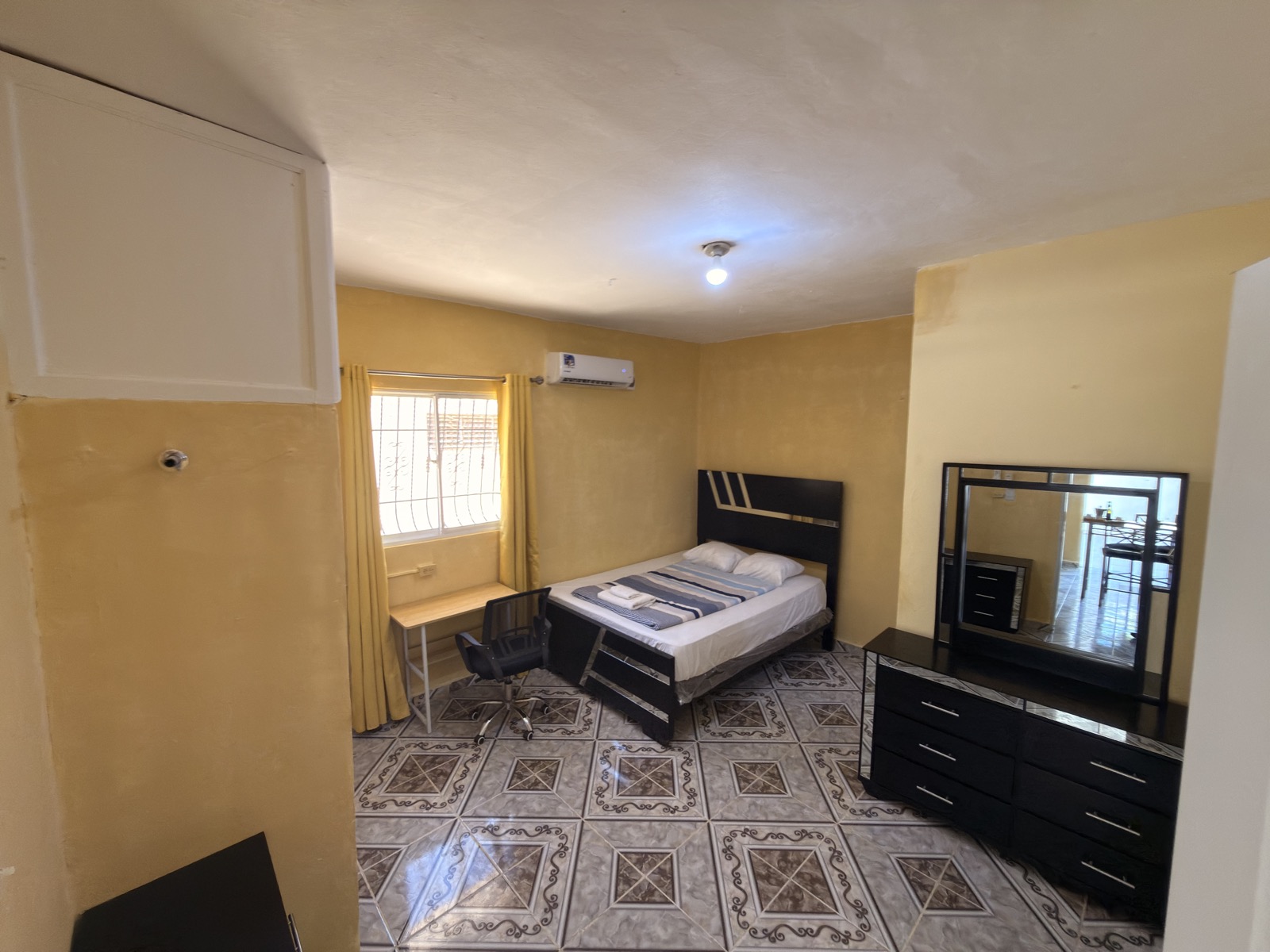 Palm Garden Suite โ bedroom with AC and workspace